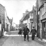 Blakeney High Street With Joshua C. Parker outside his Shop and Post Office